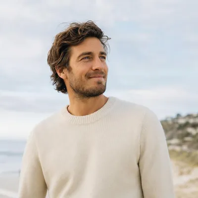 A relaxed man looking into the distance outdoors